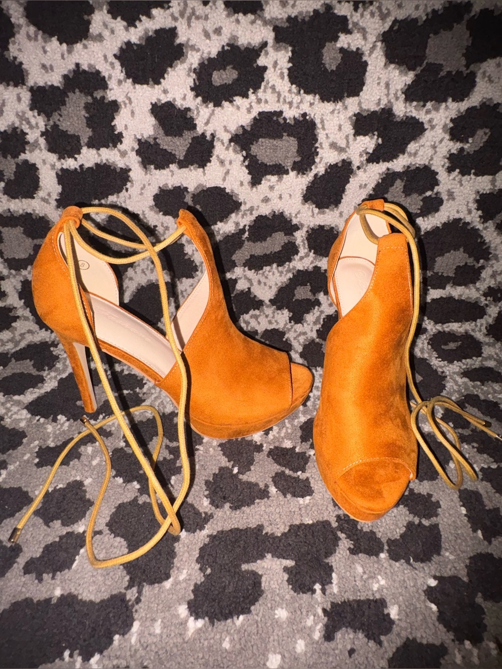 Tan tie up suede style heels.